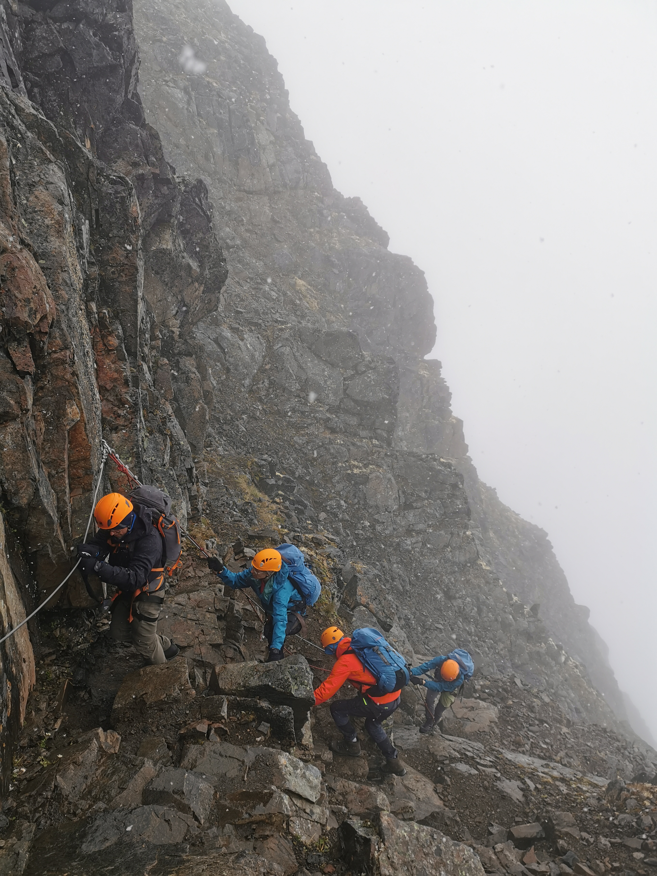 picture of cllient being guided on a mountain